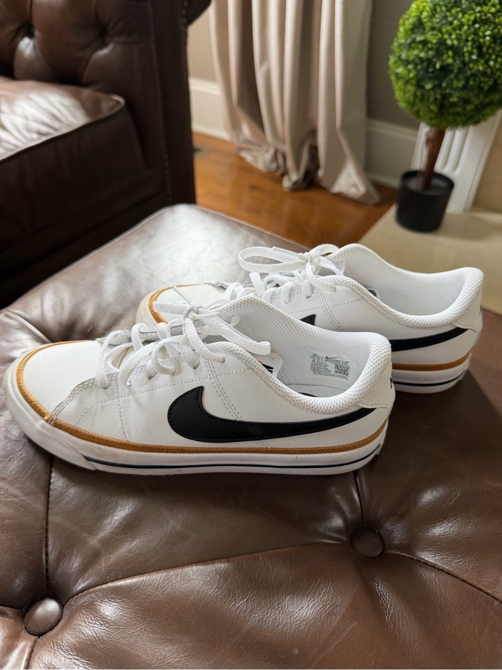 Nike Kids White Court Legacy Sneakers with Black Swoosh and Gold Accent